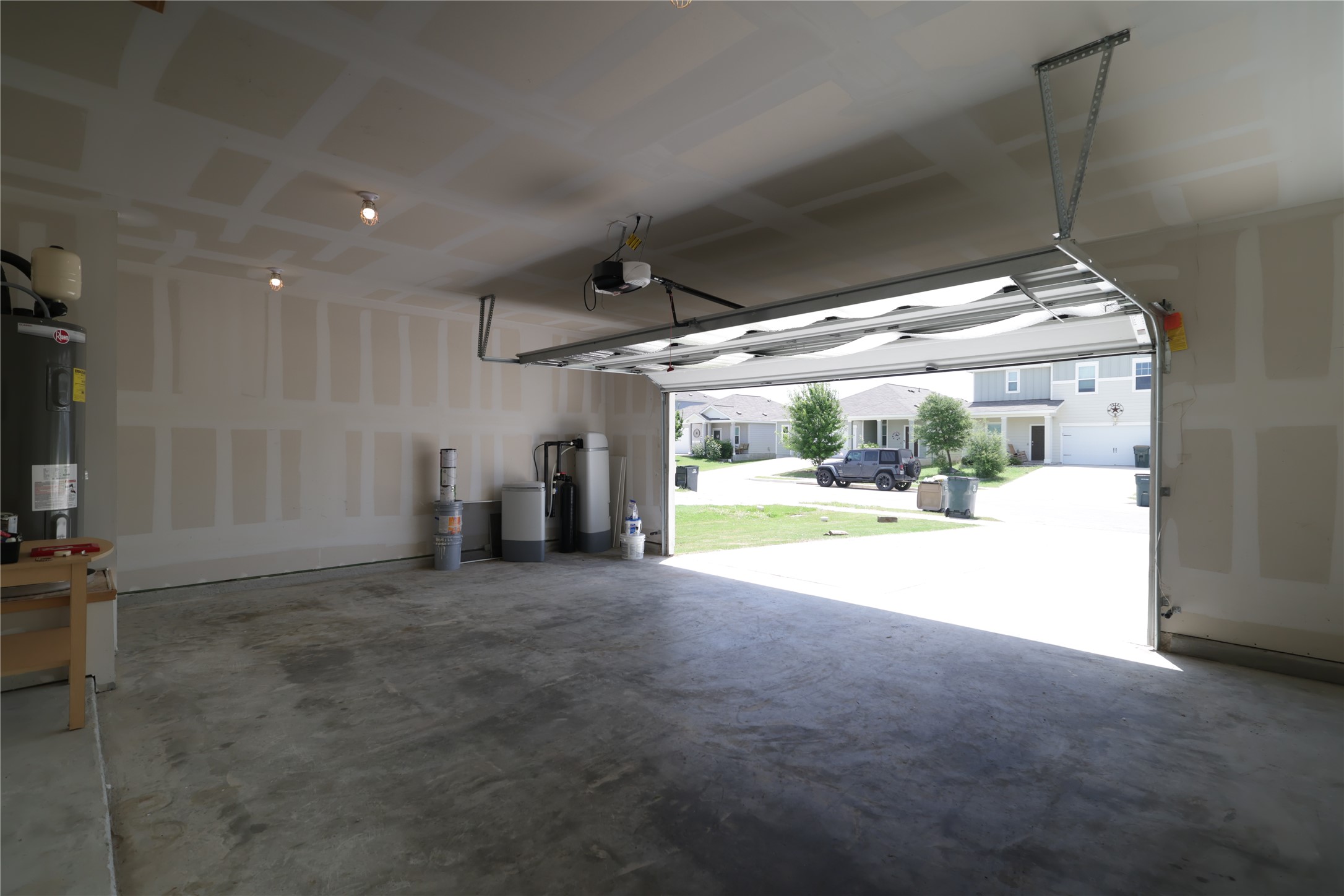 250 Seneca Loop Kyle, TX 78640 - Photo 17 of 22 Secure parking and ample storage space define this functional garage, perfect for modern living.