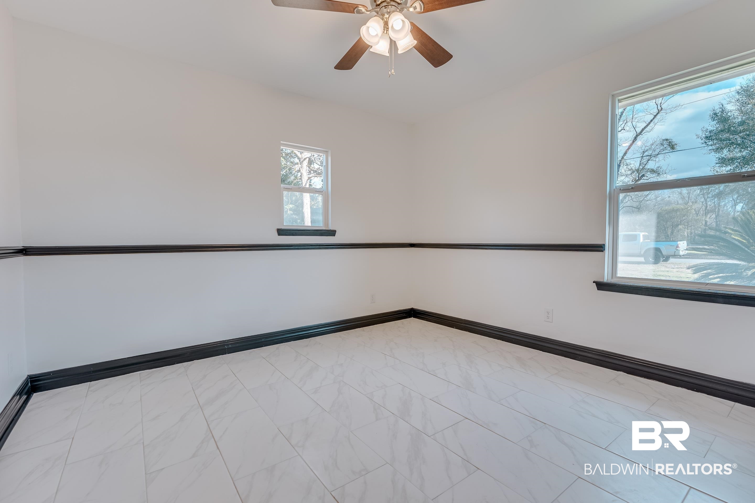 1190 Military Road Mount Vernon, AL 36560 - Photo 33 of 47 Spare room featuring baseboards and a ceiling fan