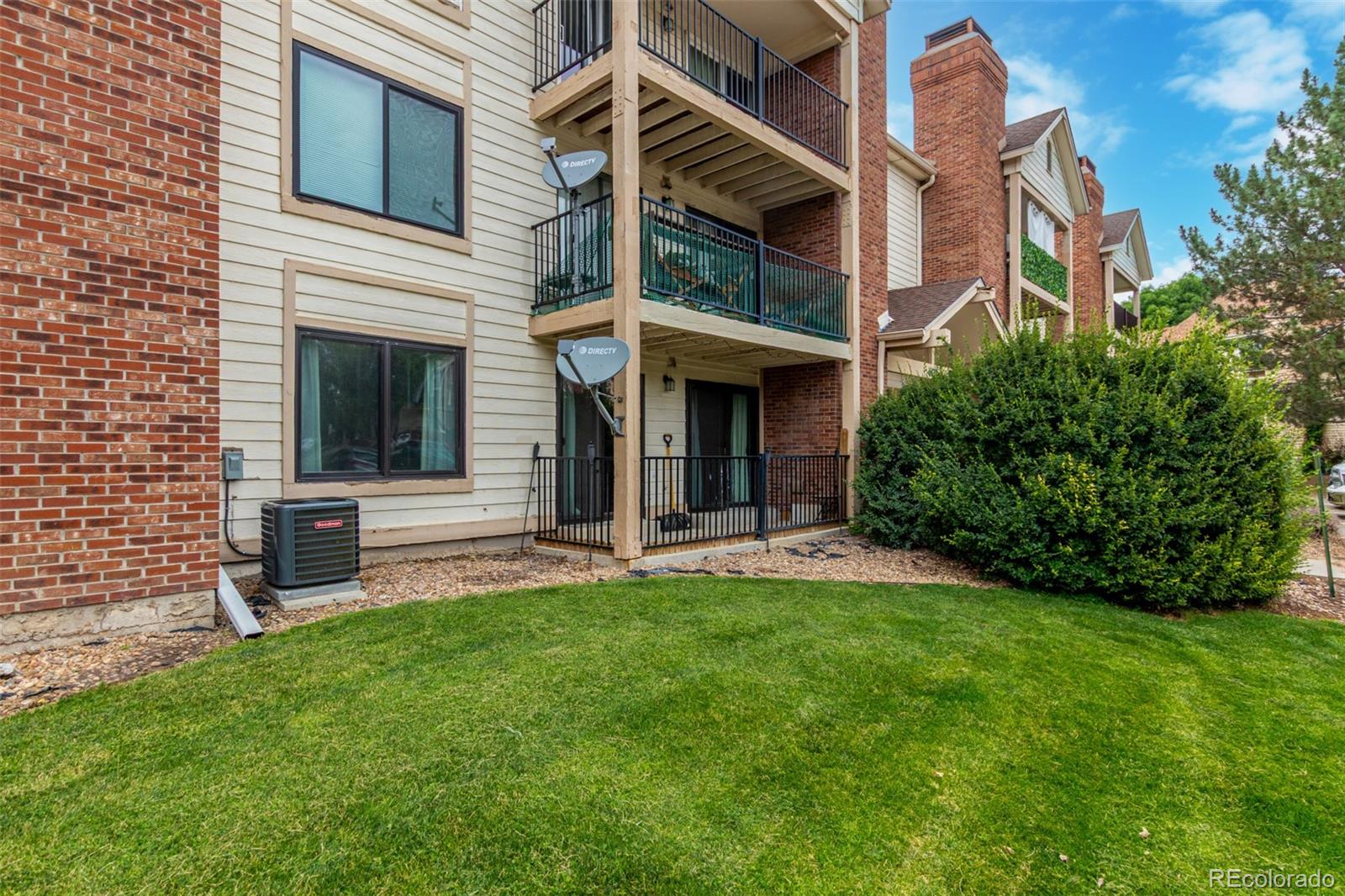 a view of an house with backyard porch and sitting area