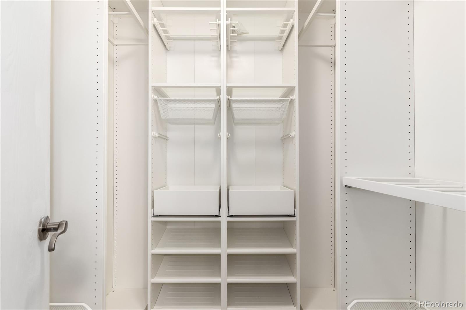 401 South Kalispell Way, Unit 104 Aurora, CO 80017 - Photo 15 of 29 a bathroom with a glass shower door