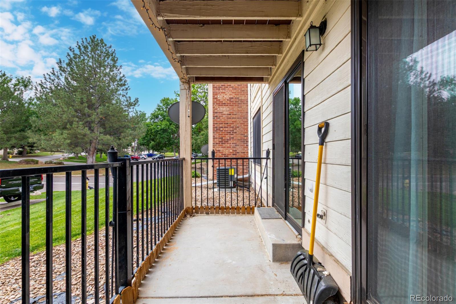 401 South Kalispell Way, Unit 104 Aurora, CO 80017 - Photo 26 of 29 a view of a balcony with wooden floor