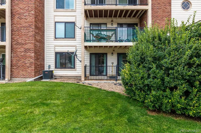 a view of an house with backyard space and garden