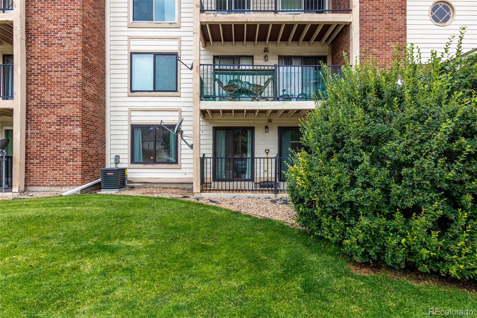 401 South Kalispell Way, Unit 104 Aurora, CO 80017 - Photo 29 of 29 a view of an house with backyard space and garden