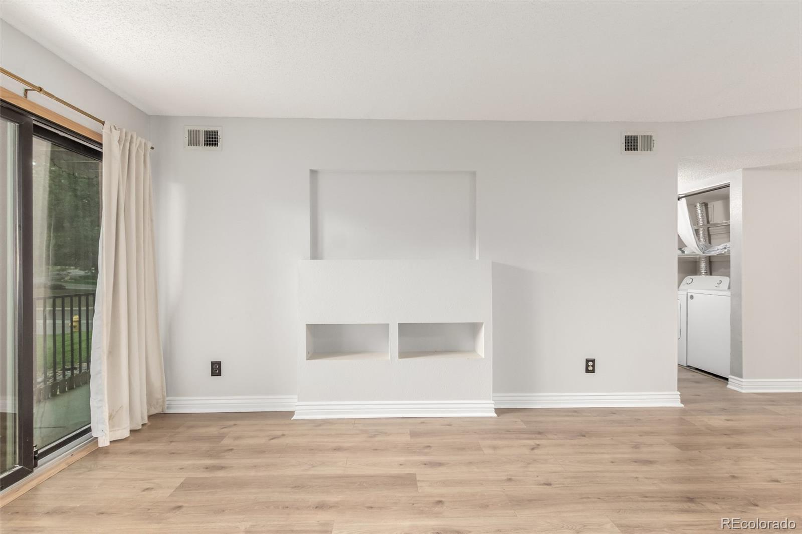 401 South Kalispell Way, Unit 104 Aurora, CO 80017 - Photo 3 of 29 a view of wooden floor