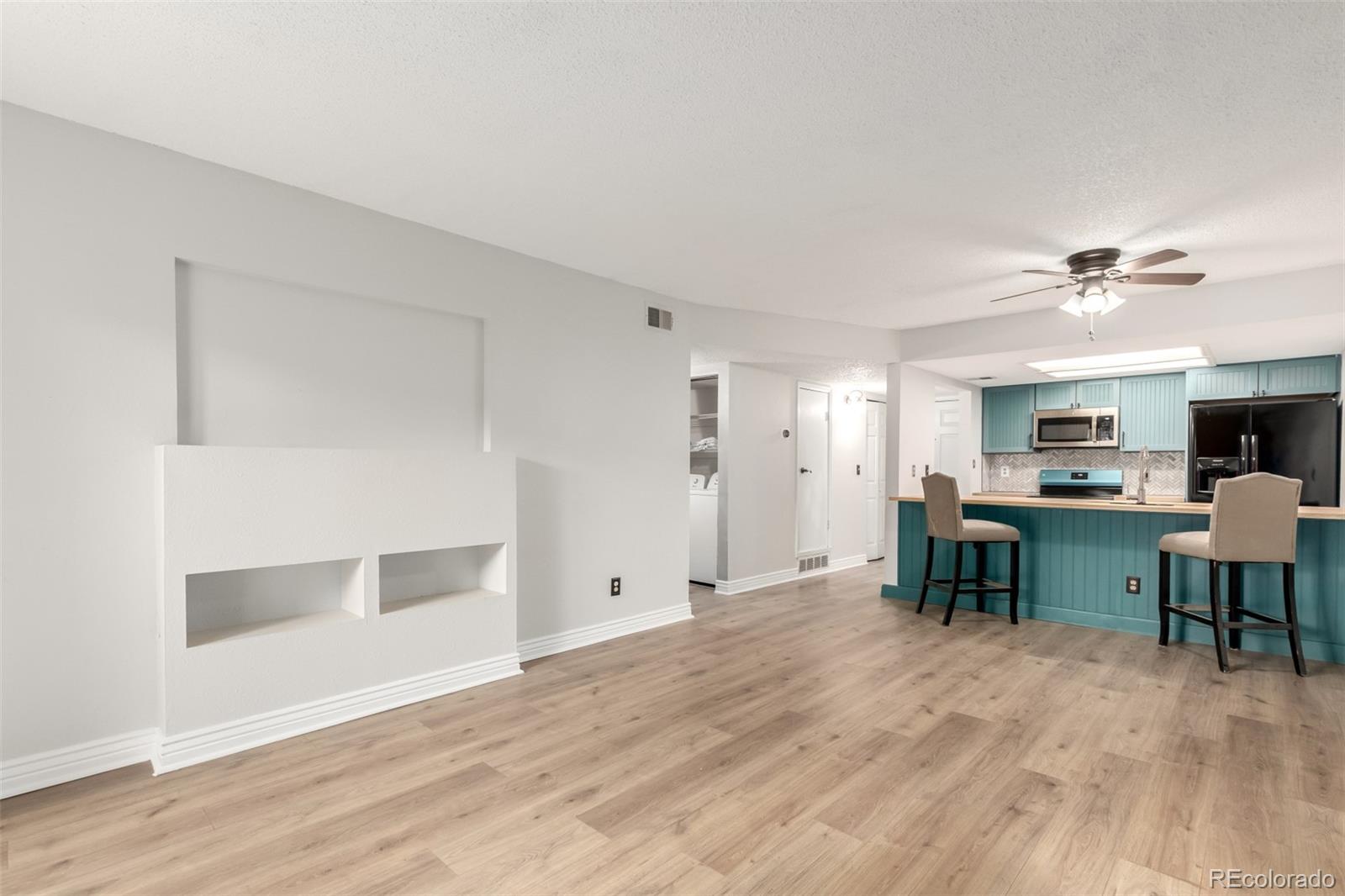401 South Kalispell Way, Unit 104 Aurora, CO 80017 - Photo 5 of 29 a view of workspace with wooden floor