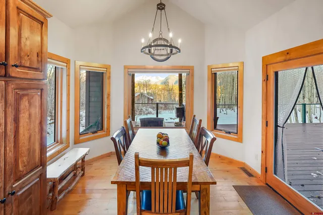 a view of a dining room with furniture window and outside view