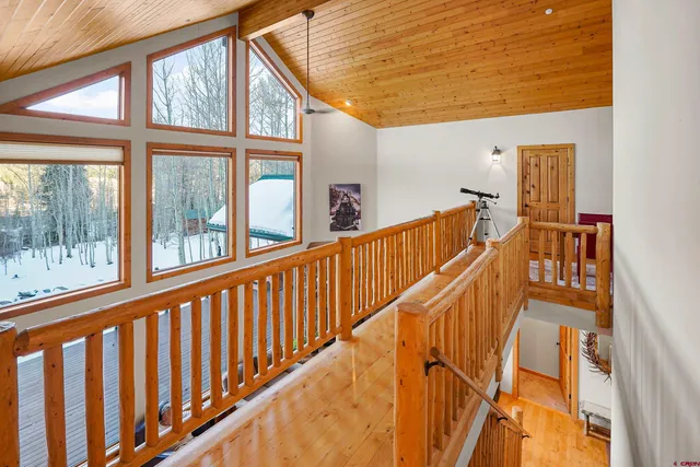 a view of staircase with large windows