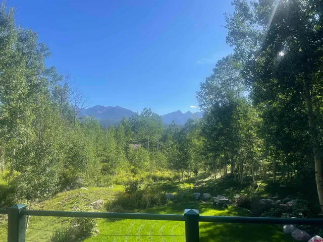 a view of lake with green space