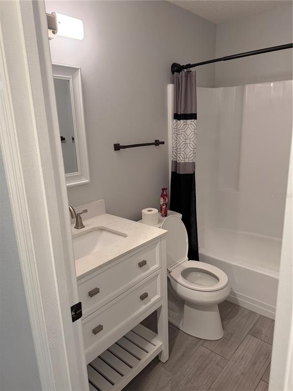 2701 Northeast 10th Street, Unit 802 Ocala, FL 34470 - Photo 12 of 16 a bathroom with a sink toilet and shower