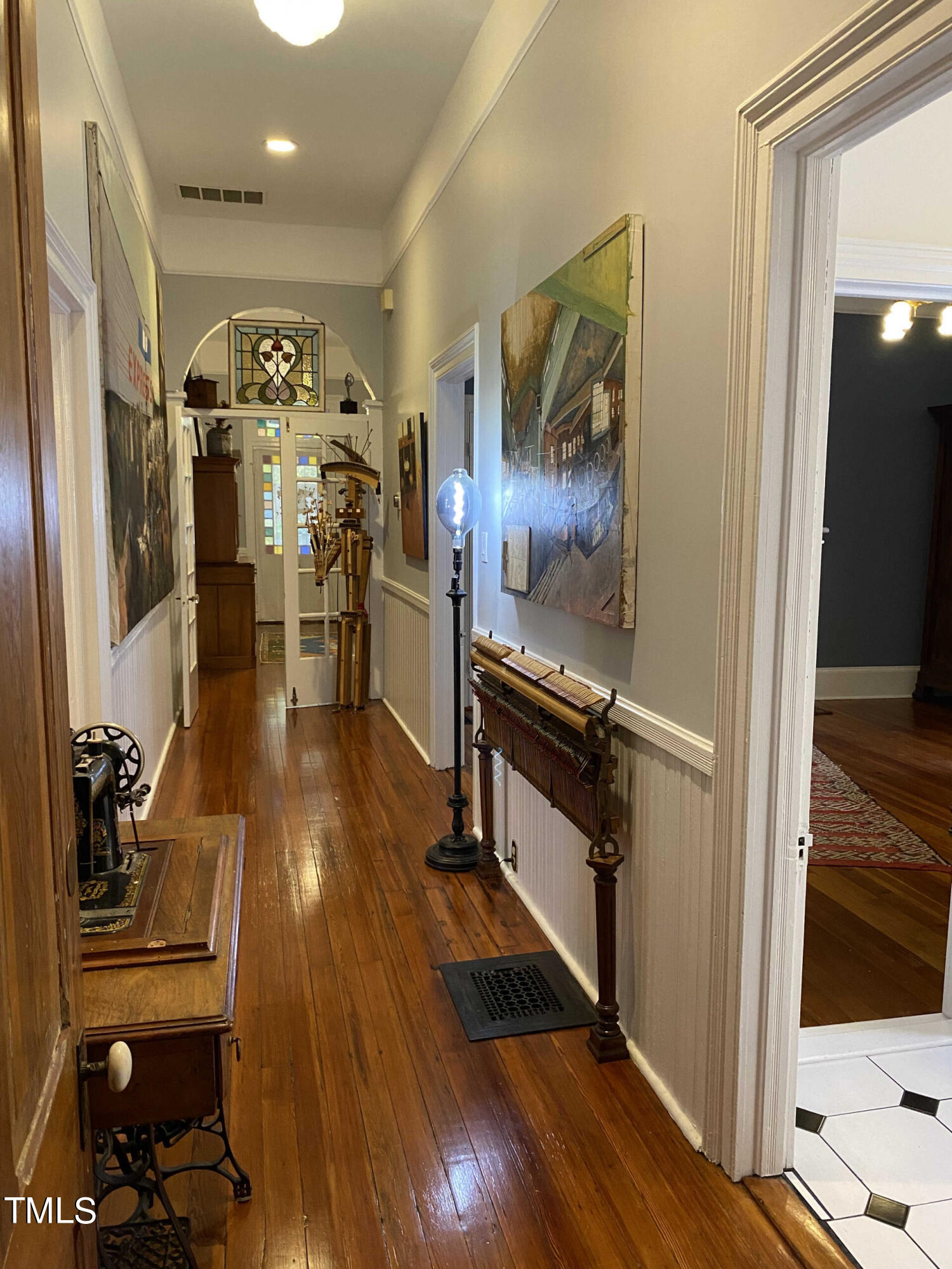 319 Polk Street Raleigh, NC 27604 - Photo 10 of 24 a view of a hallway with wooden floor and staircase
