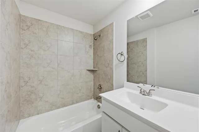 a bathroom with a sink and a bathtub