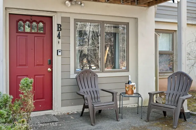 a view of front door with chair and chairs