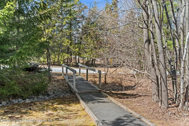 a view of a pathway with a yard