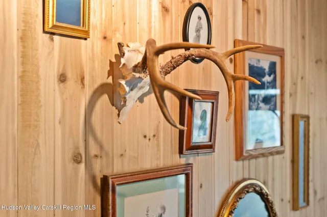 a close view of a bathroom with shower and mirror