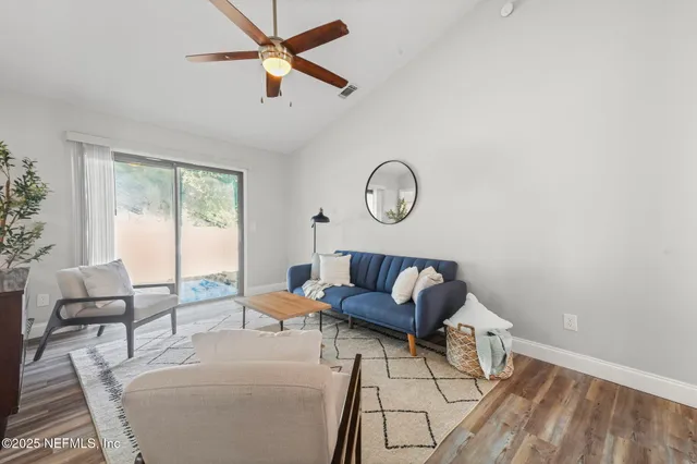 a living room with furniture and a window