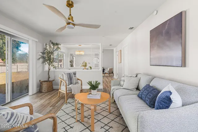 a living room with furniture and a table