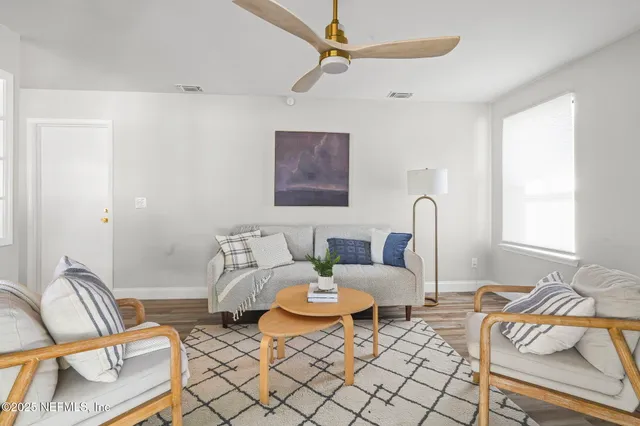 a living room with furniture and a window