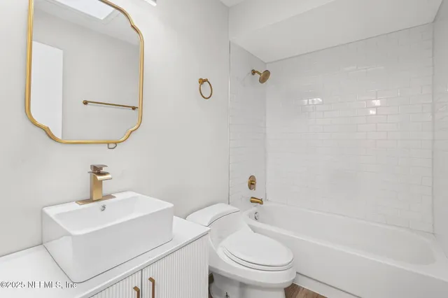 a bathroom with a sink toilet and a bathtub