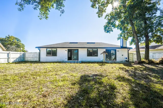 a house with swimming pool in front of it