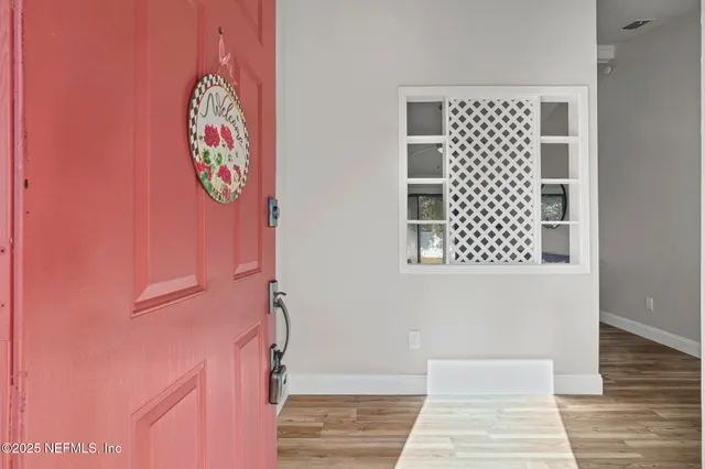a view of entryway with wooden floor