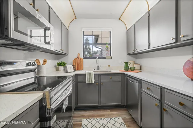 a kitchen with a cabinets and appliances