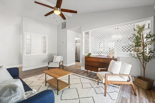 a living room with furniture and a window