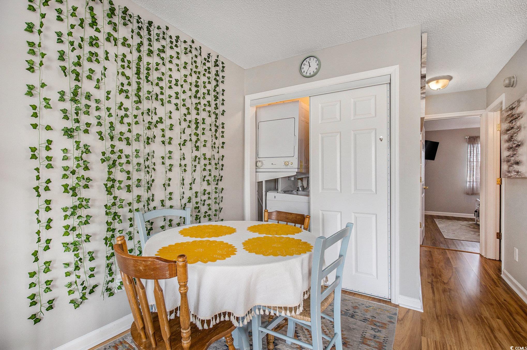 3700 Golf Colony Lane, Unit 14P Little River, SC 29566 - Photo 13 of 30 Dining area with a textured ceiling, wood finished