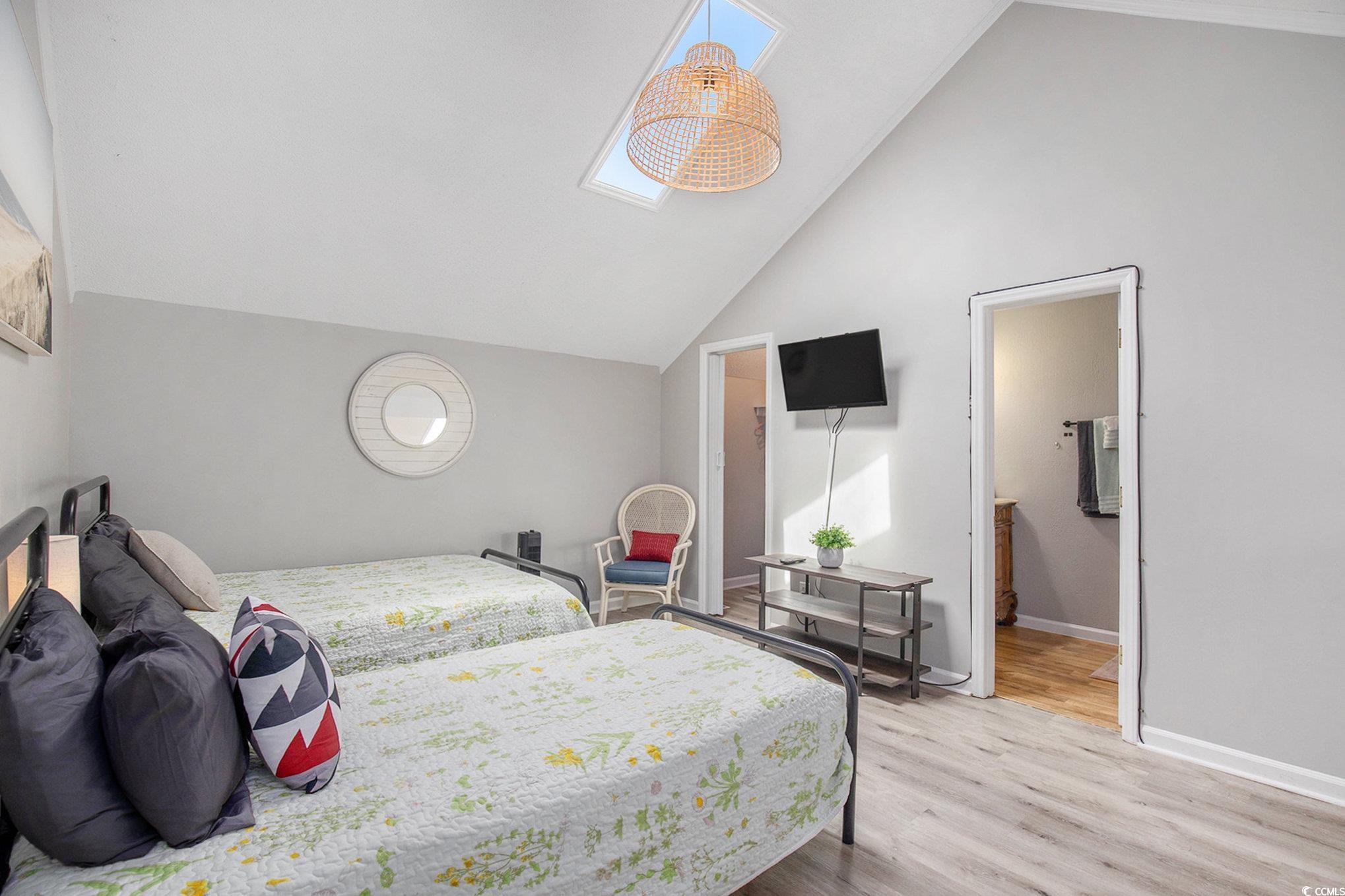 3700 Golf Colony Lane, Unit 14P Little River, SC 29566 - Photo 22 of 30 Bedroom featuring light wood finished floors and h