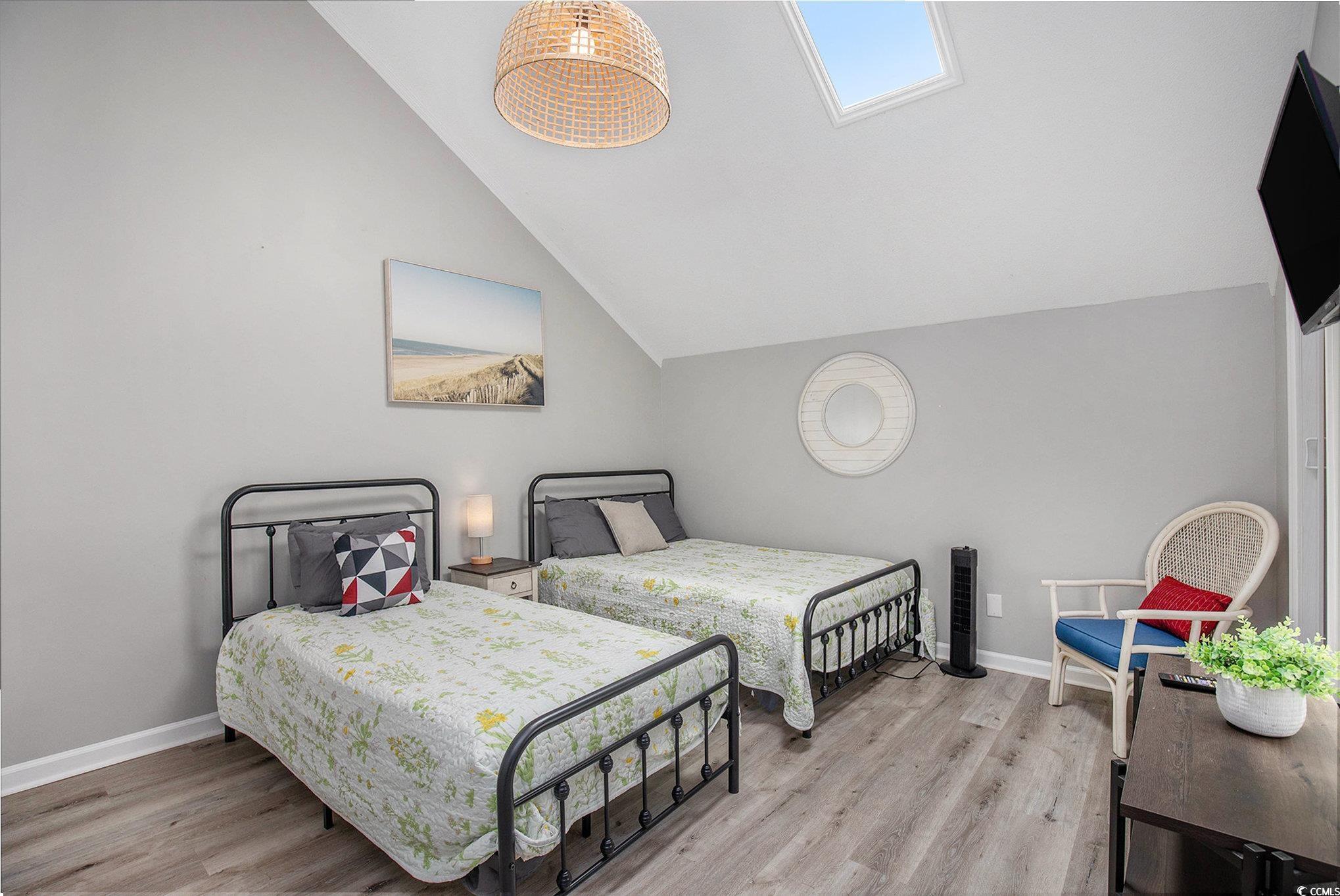 3700 Golf Colony Lane, Unit 14P Little River, SC 29566 - Photo 24 of 30 Bedroom with light wood-style flooring and high va