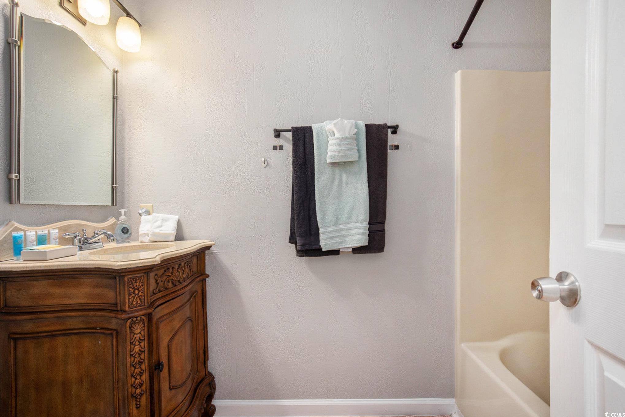 3700 Golf Colony Lane, Unit 14P Little River, SC 29566 - Photo 25 of 30 Full bath with vanity and shower combination