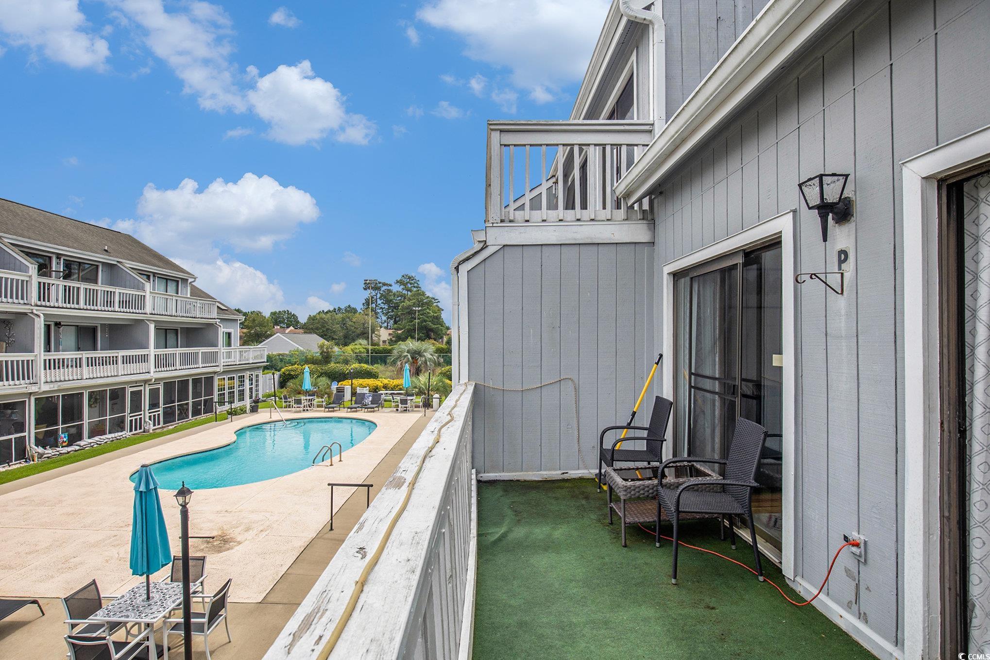 3700 Golf Colony Lane, Unit 14P Little River, SC 29566 - Photo 27 of 30 View of swimming pool featuring a balcony