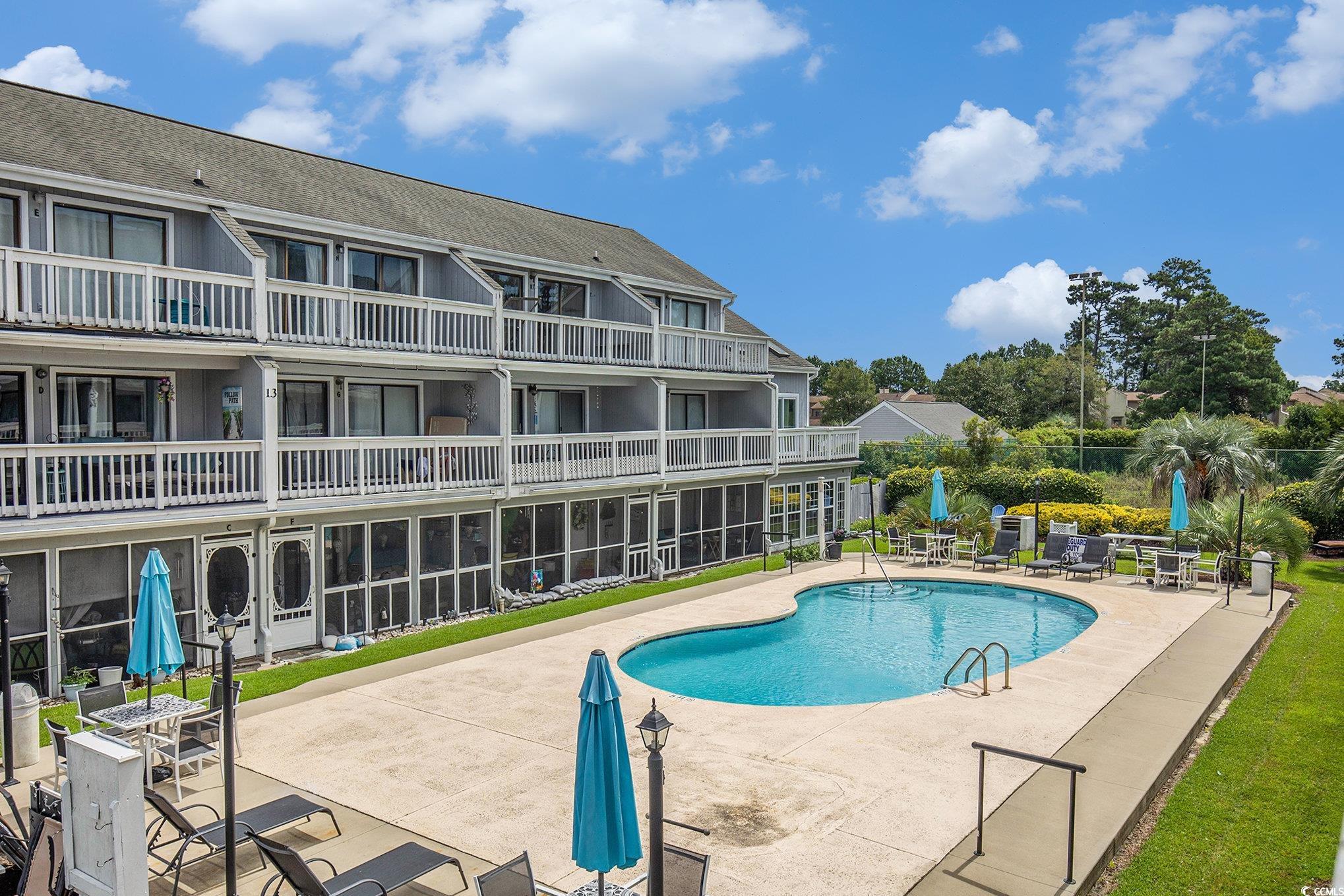 3700 Golf Colony Lane, Unit 14P Little River, SC 29566 - Photo 30 of 30 Community pool featuring a patio and a balcony