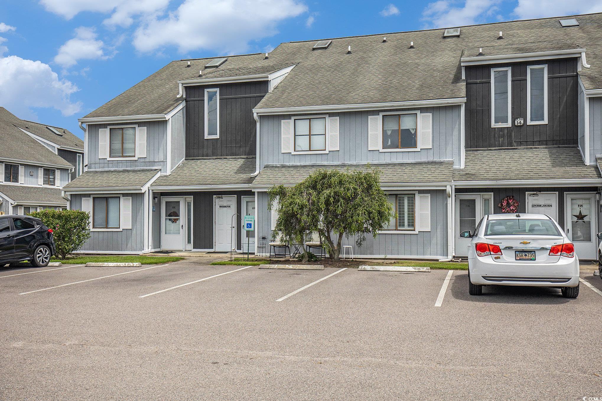 3700 Golf Colony Lane, Unit 14P Little River, SC 29566 - Photo 5 of 30 View of front of home with roof with shingles and