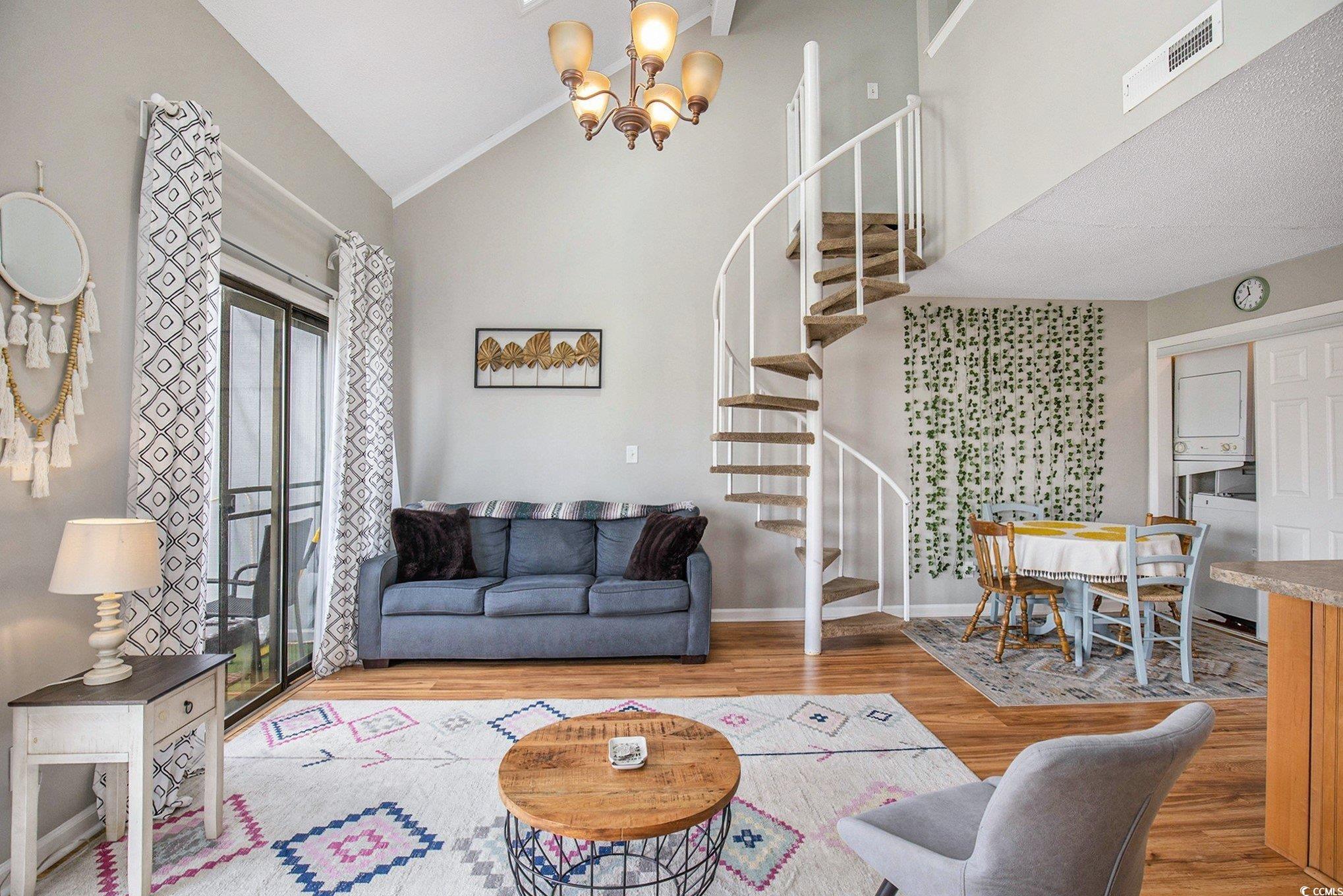 3700 Golf Colony Lane, Unit 14P Little River, SC 29566 - Photo 10 of 30 Living room with wood finished floors, stairs, a c