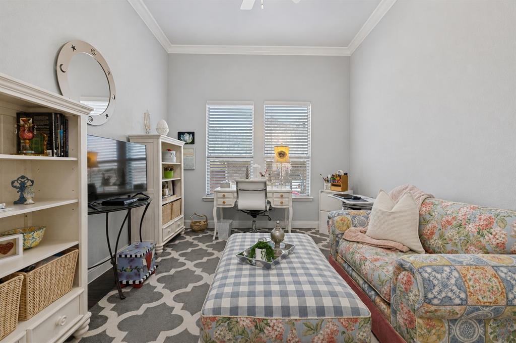 506 Life Spring Drive Rockwall, TX 75087 - Photo 6 of 36 a living room with furniture a rug and a flat screen tv