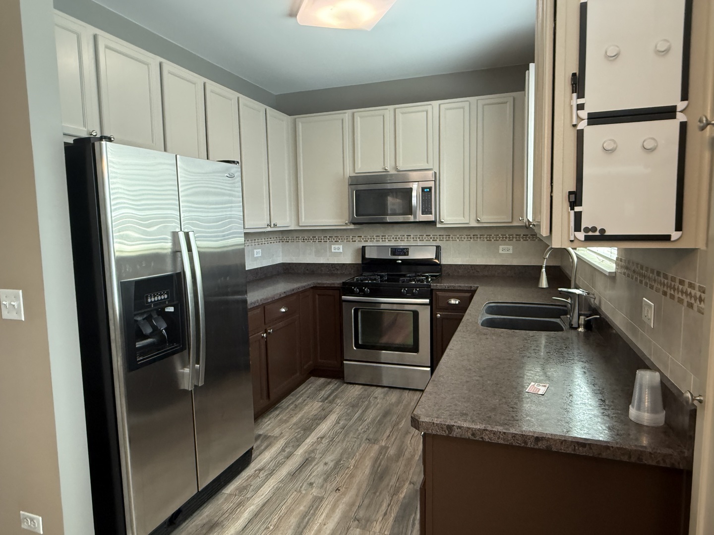 2340 Hudson Circle Aurora, IL 60502 - Photo 12 of 37 a kitchen with stainless steel appliances granite countertop a sink stove and refrigerator