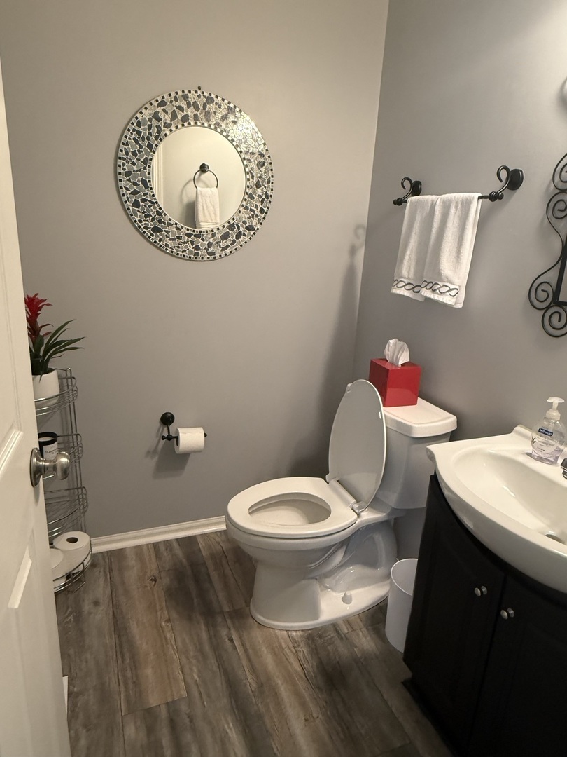 2340 Hudson Circle Aurora, IL 60502 - Photo 15 of 37 a bathroom with a toilet sink and mirror