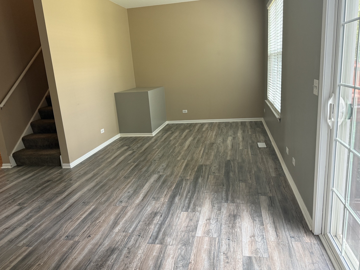 2340 Hudson Circle Aurora, IL 60502 - Photo 5 of 37 a view of wooden floor in a hall with a window