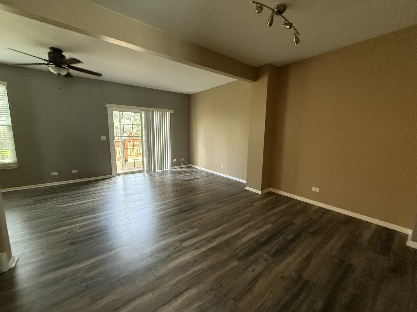 2340 Hudson Circle Aurora, IL 60502 - Photo 8 of 37 a view of an empty room with a window and wooden floor