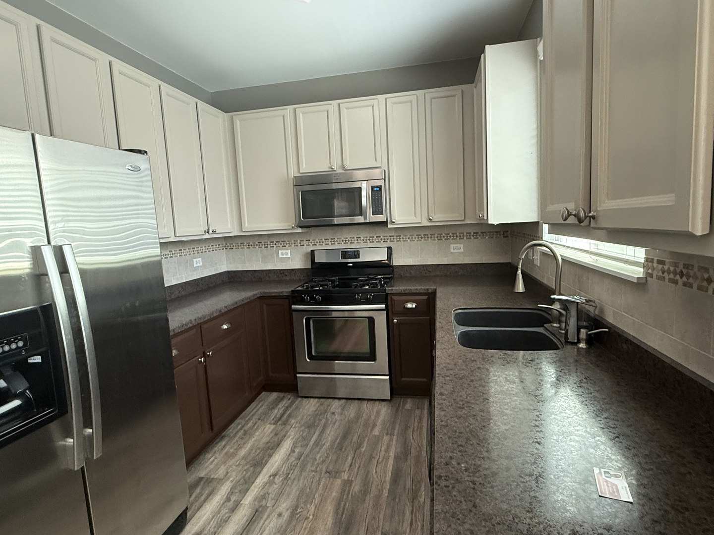 2340 Hudson Circle Aurora, IL 60502 - Photo 9 of 37 a kitchen with a sink a stove and cabinets