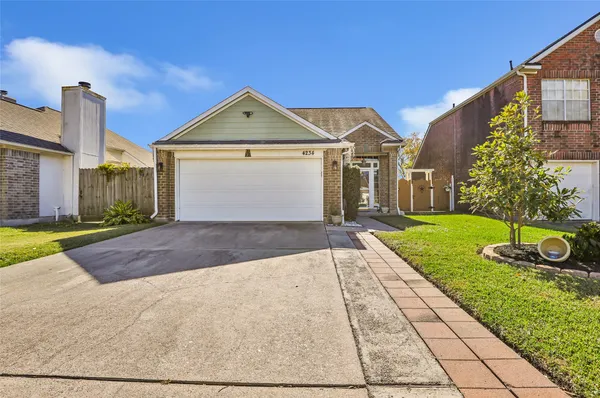 a front view of a house with yard