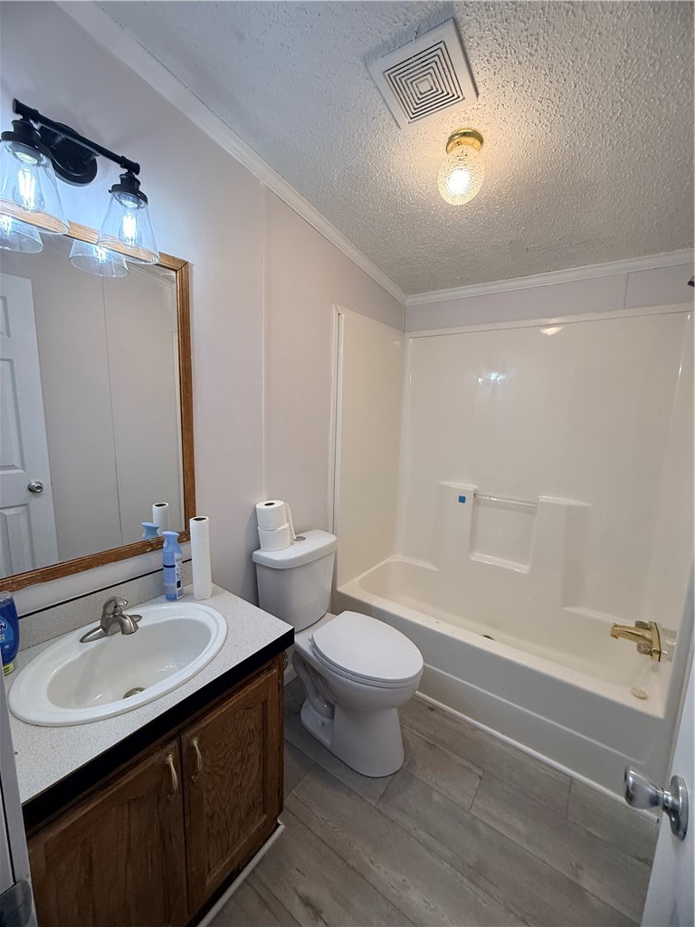 307 West 7th Street St. Elmo, IL 62458 - Photo 14 of 17 a bathroom with a double vanity sink toilet mirror and bathtub
