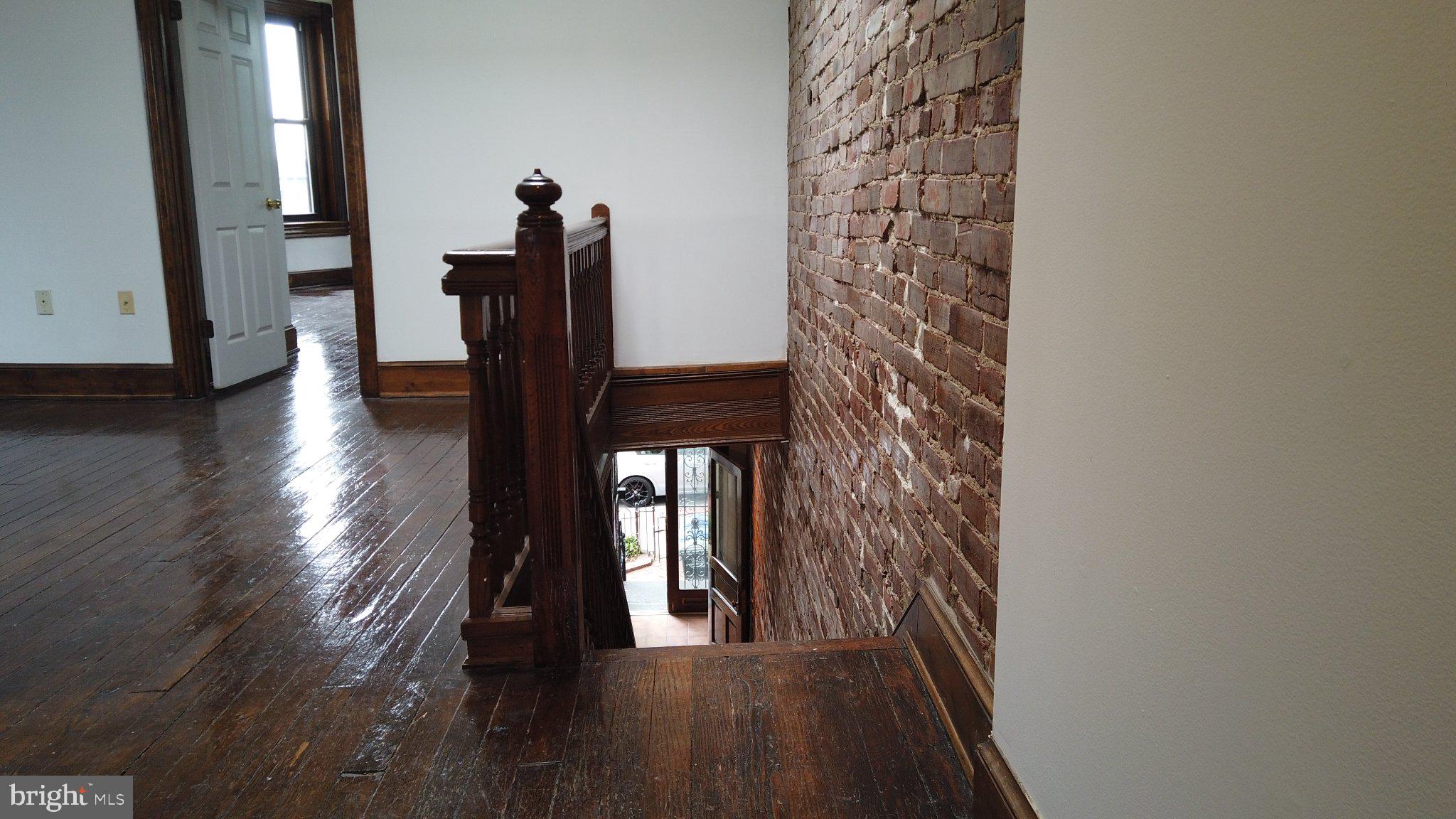 604 9th Street Northeast Washington, DC 20002 - Photo 13 of 28 Charming staircase with exposed brick.