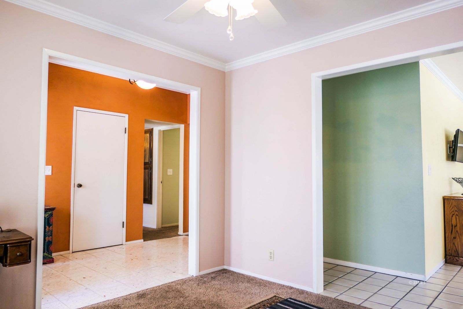 532 West Howell Avenue Ridgecrest, CA 93555 - Photo 13 of 44 a view of a hallway with a glass door and a refrigerator