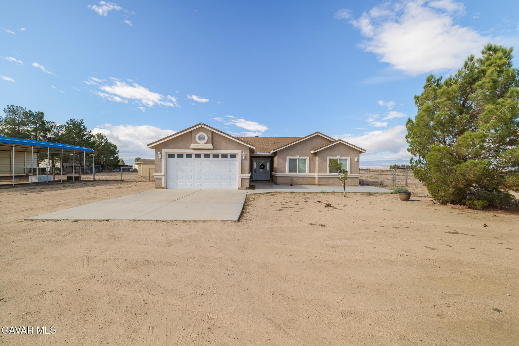 49945 80th Street West Lancaster, CA 93536 - Photo 1 of 38 a view of house with yard and car parked