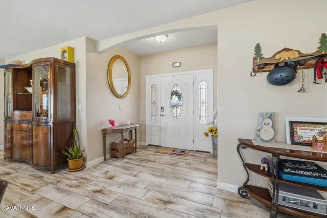 a view of a livingroom with furniture and wooden floor