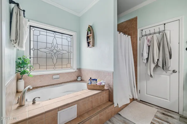 a bathroom with a tub and a sink