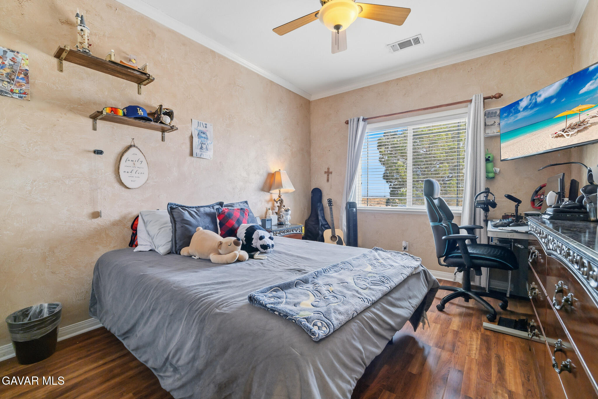 49945 80th Street West Lancaster, CA 93536 - Photo 23 of 38 a bedroom with a bed and wooden floor