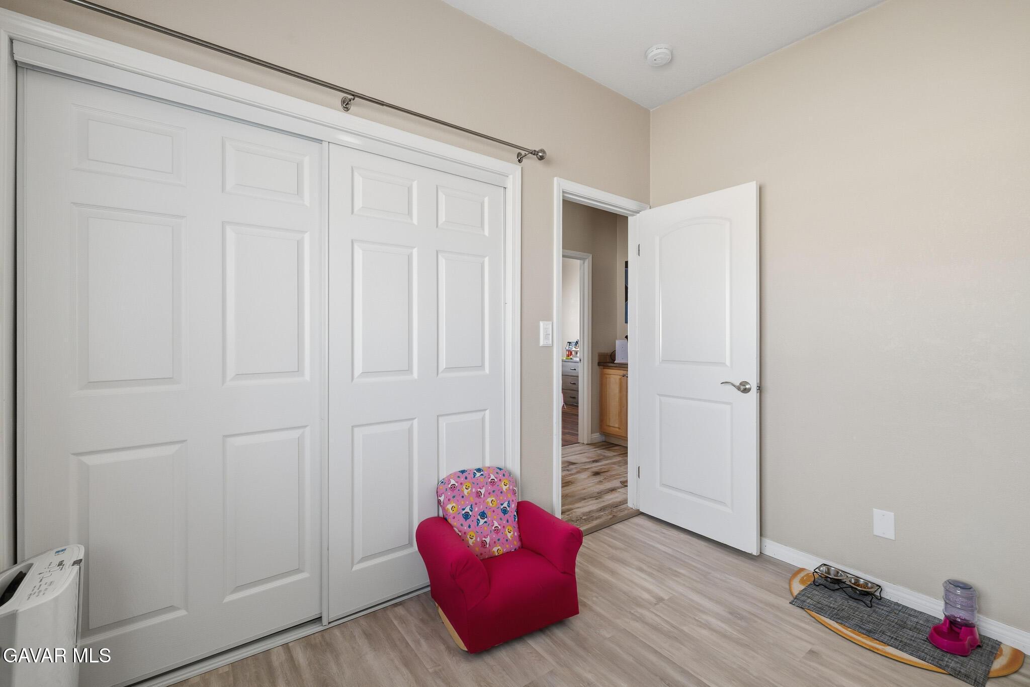 49945 80th Street West Lancaster, CA 93536 - Photo 26 of 38 a living room with furniture and wooden floor