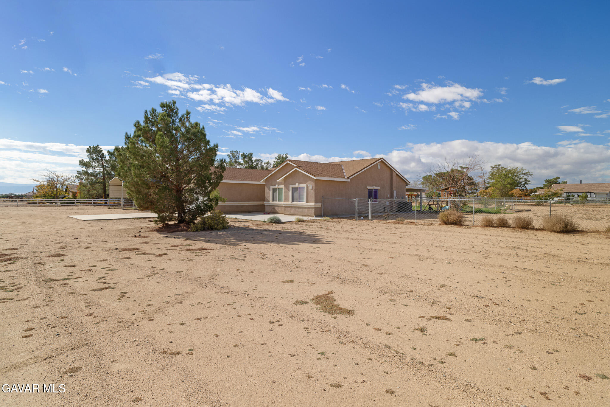49945 80th Street West Lancaster, CA 93536 - Photo 3 of 38 a view of large house with a road